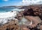 Red sand beach near Sardina del Norte lighthouse, Grand Canary island, Spain