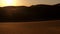 Red sand dunes in the Arabian desert at the sunset