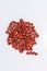 Red sandalwood seeds Adenanthera pavonina seeds on white background