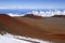 Red sands of Mauna Kea volcano with snow, Hawaii