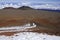 Red sands of Mauna Kea volcano with snow, Hawaii