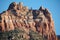 Red sandstone mountain formation, in Arizona in the U.S. Southwest with sheer cliff face.