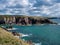 Red sandstone sedimentary bedrock cliffs in Pembrokeshire, Wales, UK