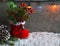 Red Santa`s boot with fir tree branch,decorative holly berry leaves,candy cane,pine cones ans garland.Christmas decoration.