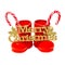 Red Santa shoes with candy sticks and golden Merry Christmas write, close up, isolated.
