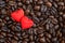 Red satin hearts on coffee beans, valentines or mothers day background, love celebrating