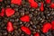 Red satin hearts on coffee beans, valentines or mothers day background, love celebrating