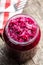 Red sauerkraut. Sour pickled cabbage in jar