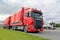 Red Scania, Green Grass, Grey Sky