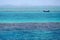 Red Sea background, clean blue water, small waves, boat, city skyline, Egypt