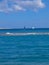 Red sea in Egypt reef, sailboat with blue sails and white yacht