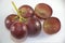 Red seedless grapes on white