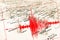 Red seismic wave over Italy map