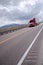 Red semi truck driving on protected highway in Nevada