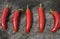 Red Serrano Peppers on a Wood Background