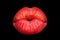 Red, sexy female lips isolated on a black background, air kiss, beautiful lips kissed, beauty red lipstick. Sensual lips