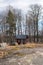 Red shack with bare trees in the background