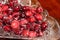 Red shiny cranberries with sugar in a crystal bowl