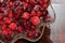 Red shiny cranberries with sugar in a crystal bowl