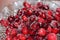 Red shiny cranberries with sugar in a crystal bowl