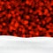 Red shiny winter background with snow and lights.