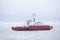 Red ship ferry transport over sea with vehicle transporter onboard