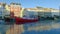 Red ship in frozen Nyhavn canal of Copenhagen