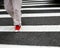 Red shoes on crosswalk