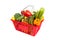 Red shopping basket with vegetables on white