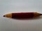 Red short pencil that is sharpened on both sides