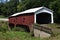 Red sided covered bridge in rural Indiana that is no longer used