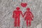 A red sign is drawn on the sidewalk of Porto: the heart, man and woman hold hands. A sign of free space for couples