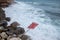 Red sign landslides danger on coastline sea