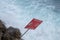 Red sign landslides danger on coastline sea