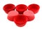 Red silicone form for cooking muffin and cupcake on white background. Molds for sweet and delicious muffins