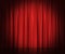 Red silk curtains for theater and cinema spotlit