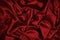 Red silk satin. Red shiny fabric background. Luxurious bright background.