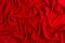 Red silk wavy background. Passion backdrop for Valentines day.