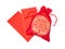 Red silky money bag with glossy red envelopes