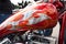 Red and silver customised motorcycle tank