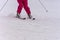 red skier skiing down snowy hill
