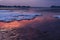 Red sky sunset over snowy Poole beach