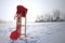 Red Sledge and warm trousers in snow landscape