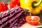 Red slice of tomato with vegan dry bread loaves near it in kitchen desk