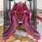 Red slides on a playground with snowy ground