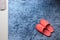 Red slipper shoe on blue carpet floor softness mat