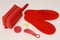 red slippers from airplane, red set from airplane is on white wooden table, red airplane items are on white background,