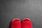 Red slippers on concrete floor