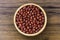 Red small Azuki beans  Adzuki or japanese red bean  in wooden bowl isolated on wood table