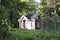 A red small wooden guest house in the woods